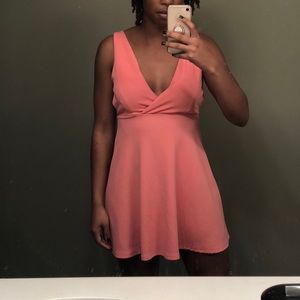 Peach flared dress with a plunging neckline
